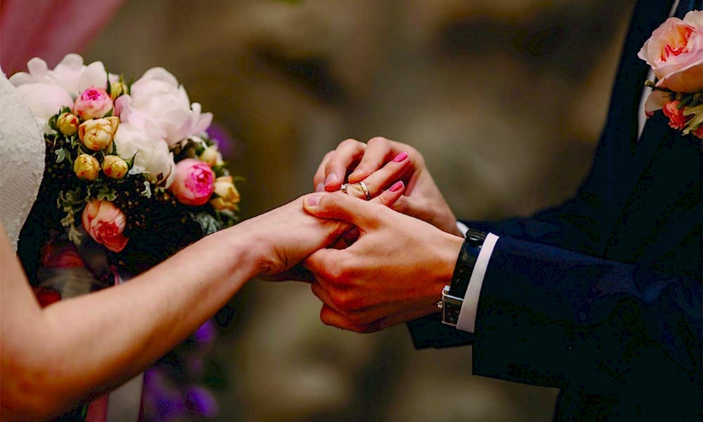 Wedding couple exchanging rings